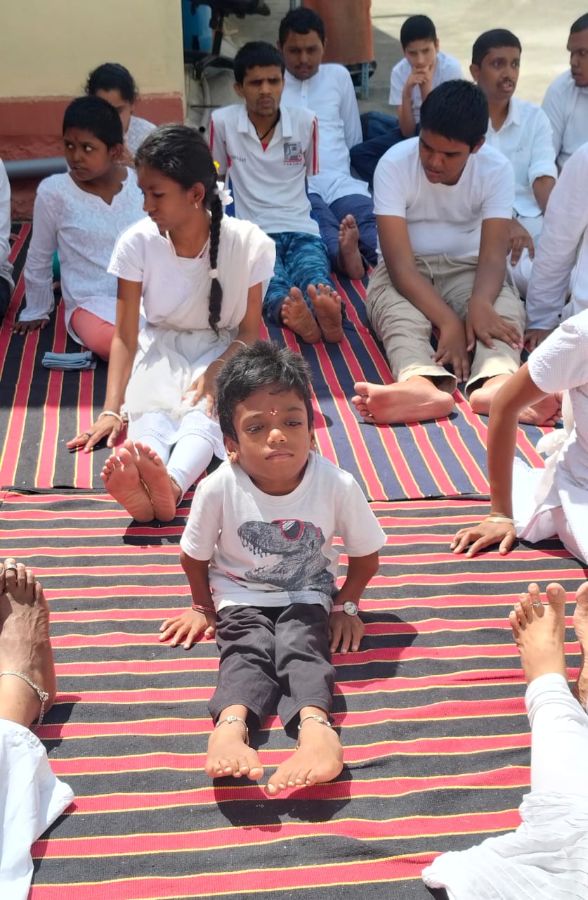 Students seated outdoors together during a guided activity